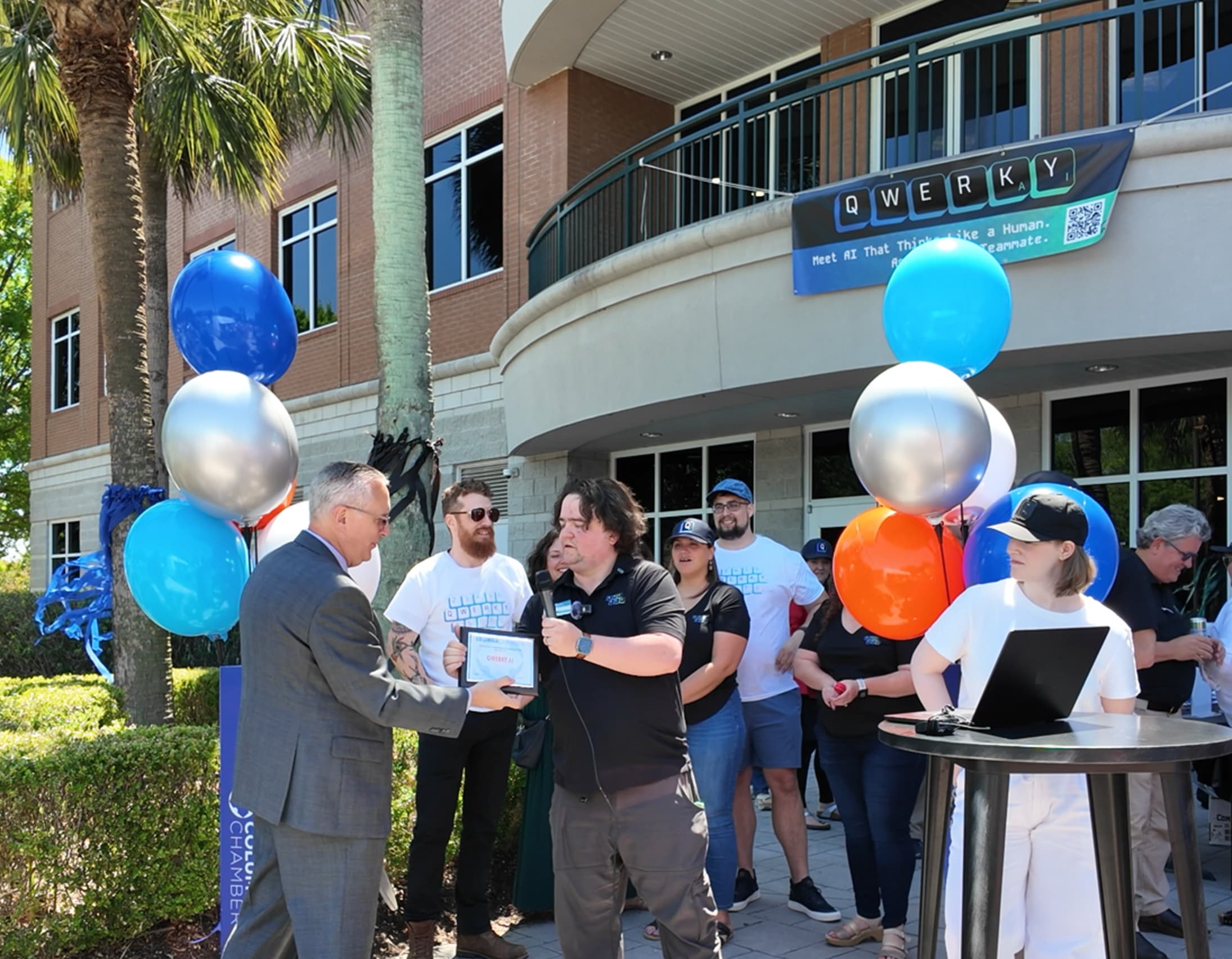 QWERKY AI co-founder Chris Thibault receives commemarative plaque from the Columbia Chamber